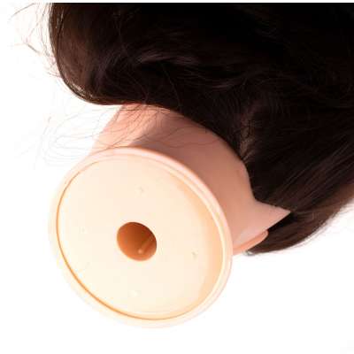 Hairdresser's training head with natural hair
