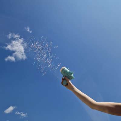 Soap bubble gun soap bubbles with wings blue