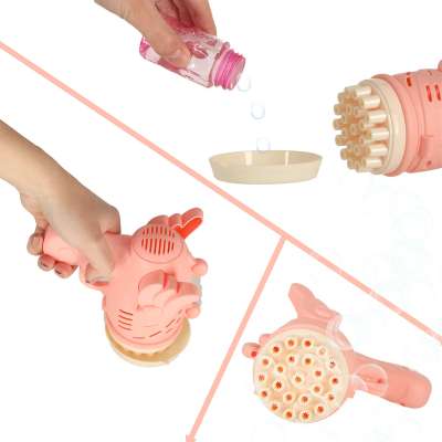 Soap bubble gun soap bubbles with wings pink