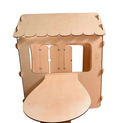 Wooden house for children with a board and table