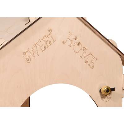 Wooden house for children with a board and table