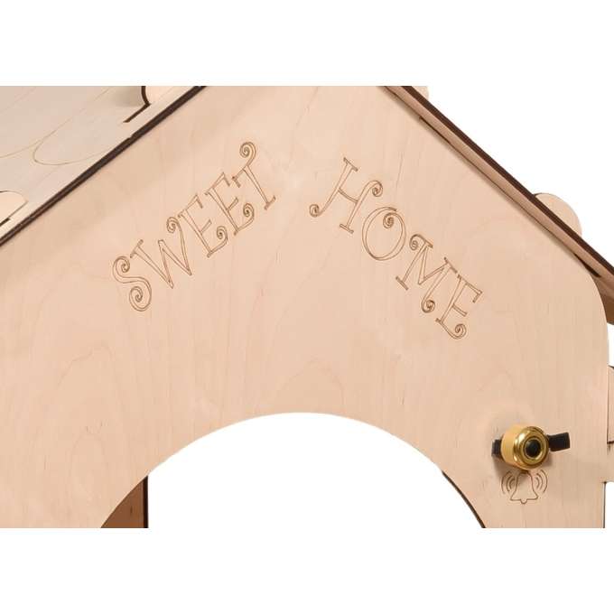Wooden house for children with a board and table